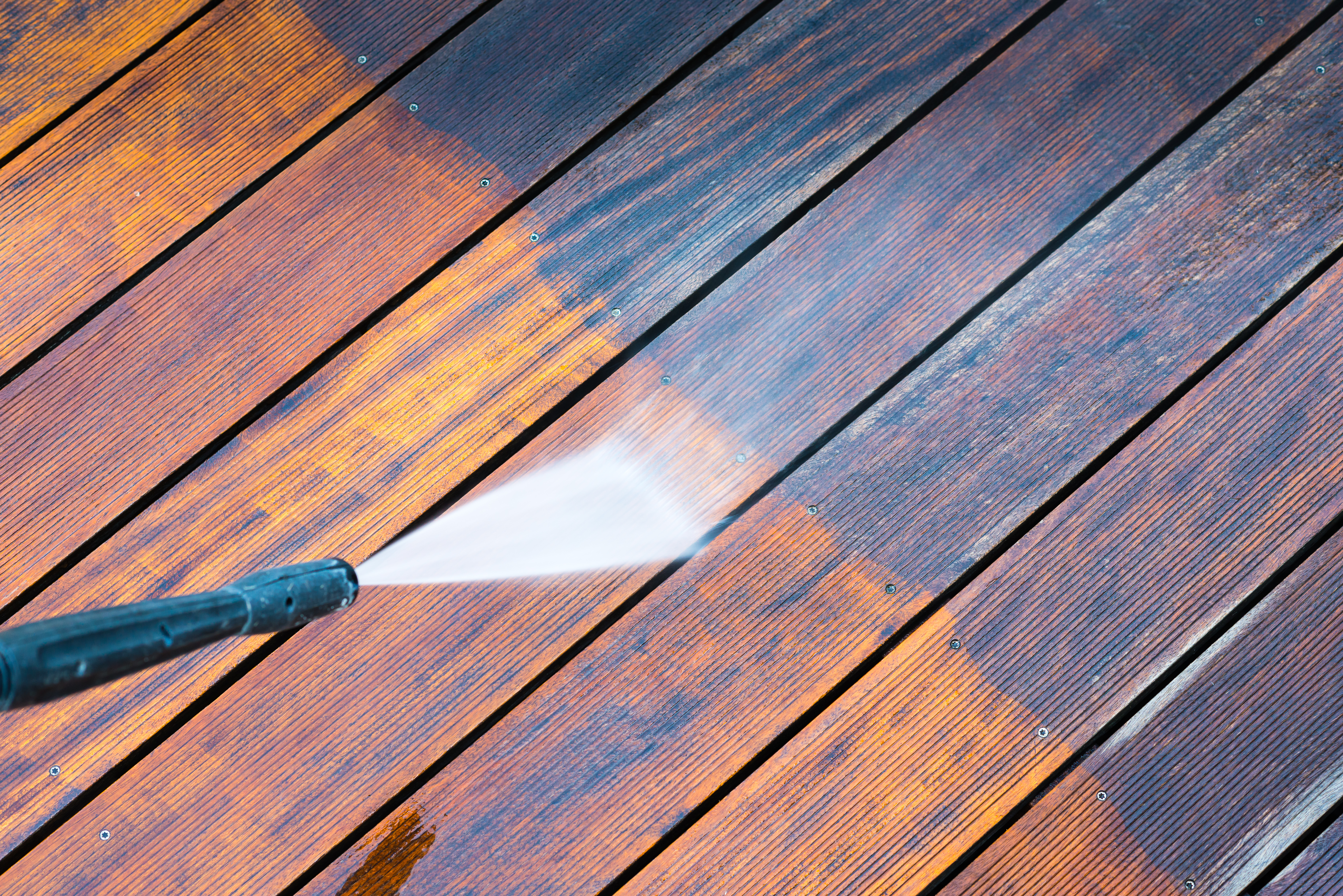 cleaning terrace with a pressure washer